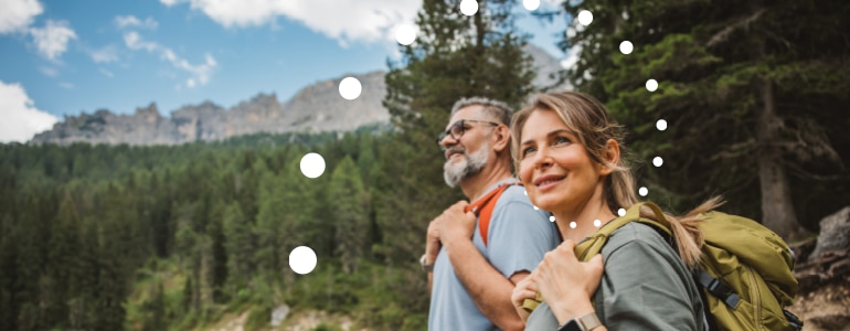 A man and woman hiking through the mountains